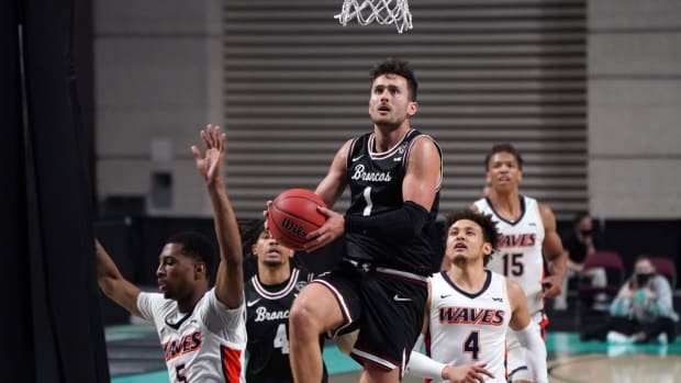 Mar 6, 2021; Las Vegas, NV, USA; Santa Clara Broncos guard Christian Carlyle (1) drives against Pepperdine Waves guard Jade' Smith (5) and guard Colbey Ross (4) in the first half at Orleans Arena. Mandatory Credit: Kirby Lee-USA TODAY Sports